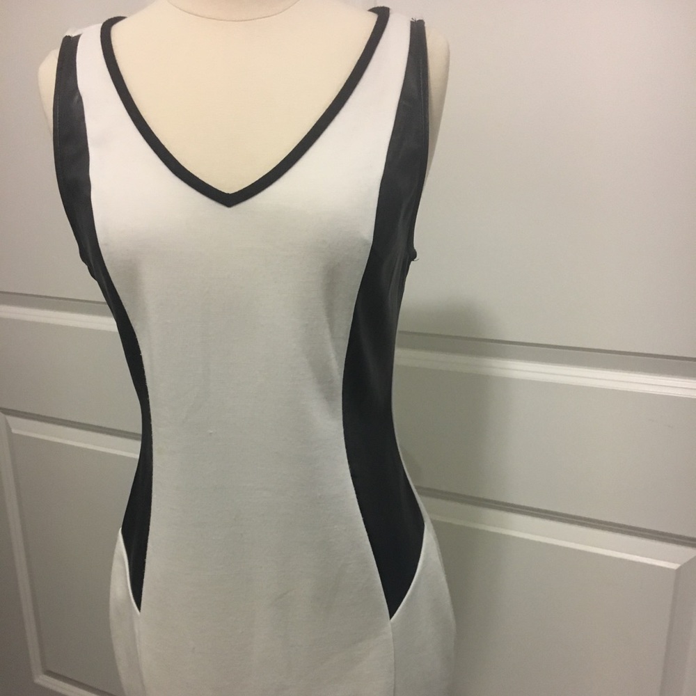 White dress with faux leather black sides.